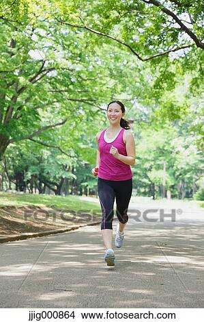 Young Japanese girl running in the park View Large Photo Image Picture - Young Japanese girl running in the park. Fotosearch