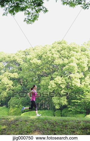 Young Japanese girl running in the park View Large Photo Image Stock Image - Young Japanese girl running in the park. Fotosearch