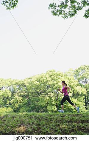 Young Japanese girl running in the park View Large Photo Image Stock Image - Young Japanese girl running in the park. Fotosearch