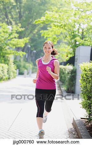 Young Japanese girl running in the park View Large Photo Image Stock Image - Young Japanese girl running in the park. Fotosearch