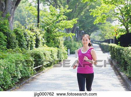 Young Japanese girl running in the park View Large Photo Image Stock Image - Young Japanese girl running in the park. Fotosearch