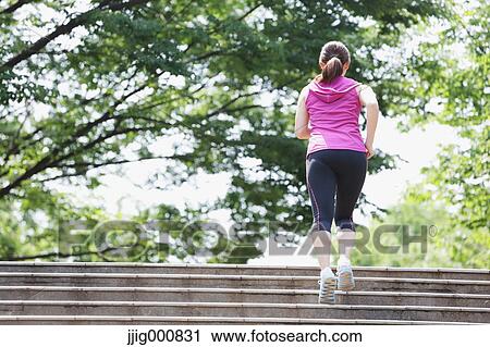 Young Japanese girl running in the park View Large Photo Image Stock Image - Young Japanese girl running in the park. Fotosearch