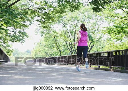 Young Japanese girl running in the park View Large Photo Image Stock Image - Young Japanese girl running in the park. Fotosearch