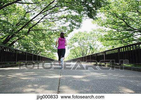 Young Japanese girl running in the park View Large Photo Image Stock Image - Young Japanese girl running in the park. Fotosearch