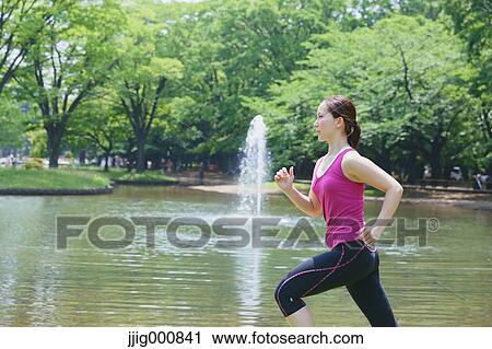Young Japanese girl running in the park View Large Photo Image Stock Image - Young Japanese girl running in the park. Fotosearch