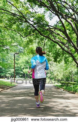 Young Japanese girl running in the park View Large Photo Image Stock Image - Young Japanese girl running in the park. Fotosearch