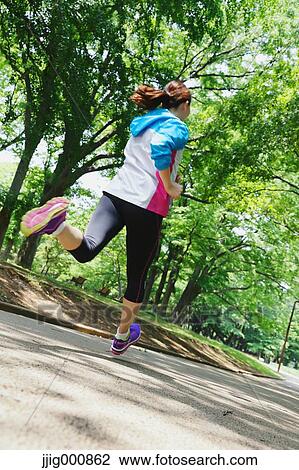 Young Japanese girl running in the park View Large Photo Image Stock Image - Young Japanese girl running in the park. Fotosearch