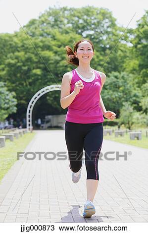 Young Japanese girl running in the park View Large Photo Image Stock Image - Young Japanese girl running in the park. Fotosearch