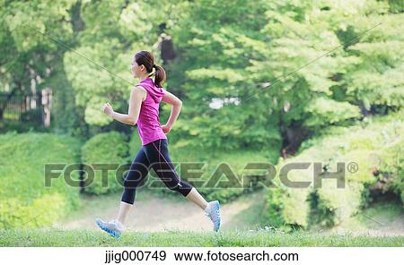 Young Japanese girl running in the park View Large Photo Image Stock Photo - Young Japanese girl running in the park. Fotosearch