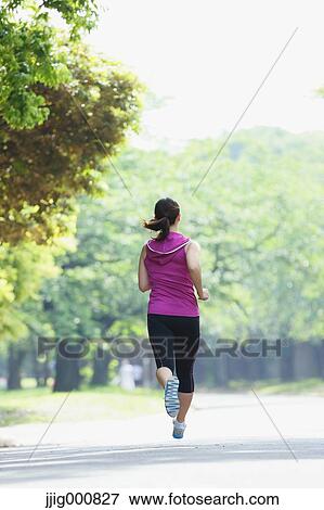 Young Japanese girl running in the park View Large Photo Image Stock Photo - Young Japanese girl running in the park. Fotosearch