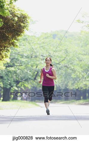Young Japanese girl running in the park View Large Photo Image Stock Photo - Young Japanese girl running in the park. Fotosearch