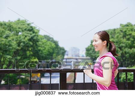 Young Japanese girl running in the park View Large Photo Image Stock Photo - Young Japanese girl running in the park. Fotosearch