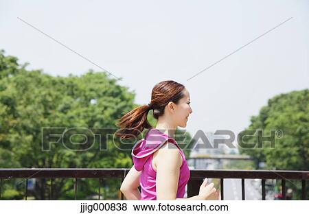 Young Japanese girl running in the park View Large Photo Image Stock Photo - Young Japanese girl running in the park. Fotosearch