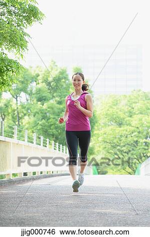 Young Japanese girl running in the park View Large Photo Image Stock Photograph - Young Japanese girl running in the park. Fotosearch