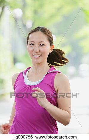 Young Japanese girl running in the park View Large Photo Image Stock Photograph - Young Japanese girl running in the park. Fotosearch