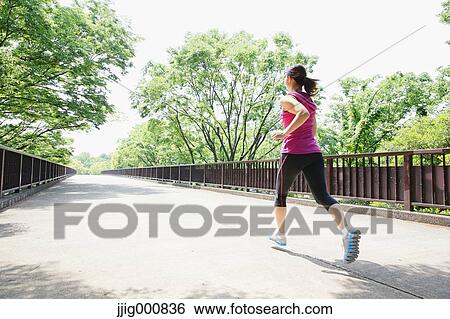 Young Japanese girl running in the park View Large Photo Image Stock Photograph - Young Japanese girl running in the park. Fotosearch