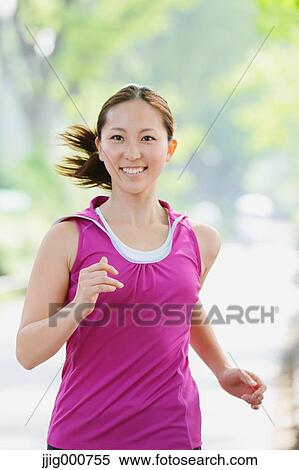 Young Japanese girl running in the park View Large Photo Image Stock Photography - Young Japanese girl running in the park. Fotosearch