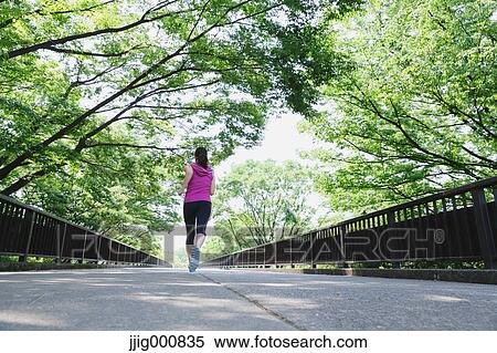 Young Japanese girl running in the park View Large Photo Image Stock Photography - Young Japanese girl running in the park. Fotosearch