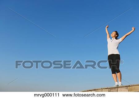 Young Japanese girl stretching View Large Photo Image Stock Image - Young Japanese girl stretching. Fotosearch