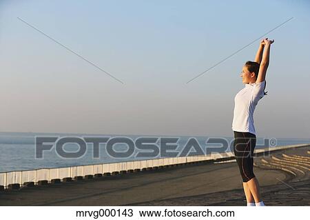 Young Japanese girl stretching View Large Photo Image Stock Image - Young Japanese girl stretching. Fotosearch