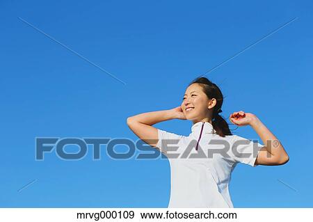 Stock Photo - Young Japanese girl stretching. Fotosearch