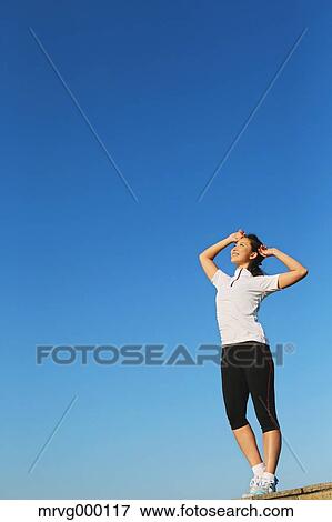 Young Japanese girl stretching View Large Photo Image Stock Photo - Young Japanese girl stretching. Fotosearch