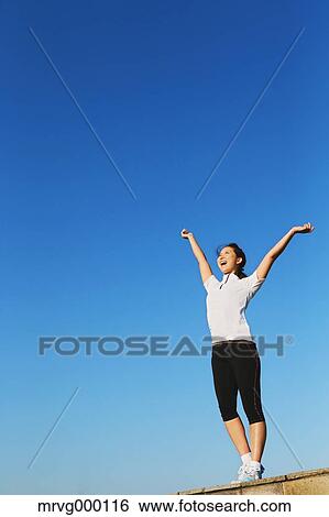 Stock Photograph - Young Japanese girl stretching. Fotosearch