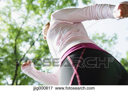 Stock Photo - Young Japanese girl walking in the park. Fotosearch