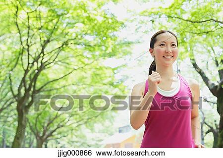 Young Japanese girl walking in the park View Large Photo Image Stock Photograph - Young Japanese girl walking in the park. Fotosearch