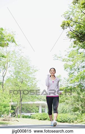 Young Japanese girl walking in the park View Large Photo Image Stock Photography - Young Japanese girl walking in the park. Fotosearch