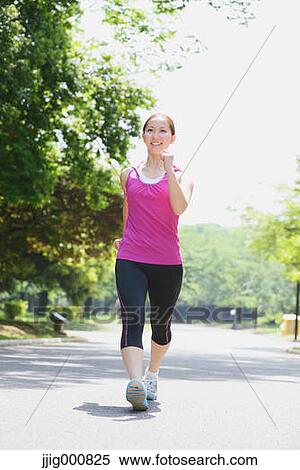 Young Japanese girl walking in the park View Large Photo Image Stock Photography - Young Japanese girl walking in the park. Fotosearch