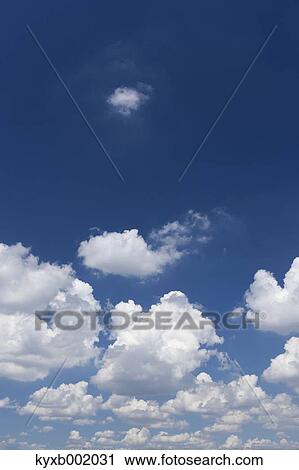 Blue sky with clouds View Large Photo Image Stock Image - Blue sky with clouds. Fotosearch