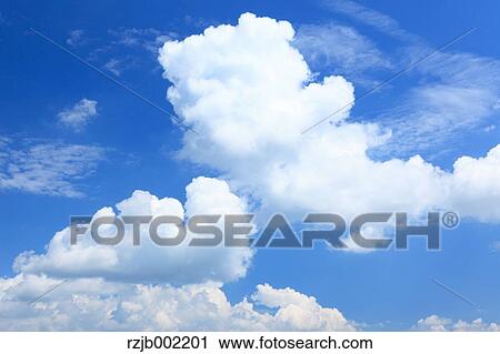 Blue sky with clouds View Large Photo Image Stock Image - Blue sky with clouds. Fotosearch