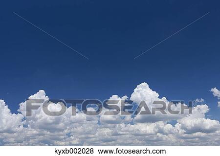 Stock Photo - Blue sky with clouds. Fotosearch
