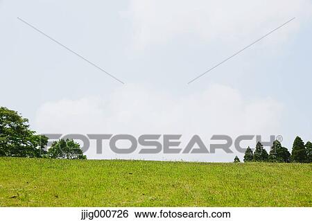 Green hill and sky View Large Photo Image Stock Photograph - Green hill and sky. Fotosearch