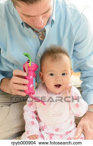 Newborn with his dad in the house View Large Photo Image Picture - Newborn with his dad in the house. Fotosearch