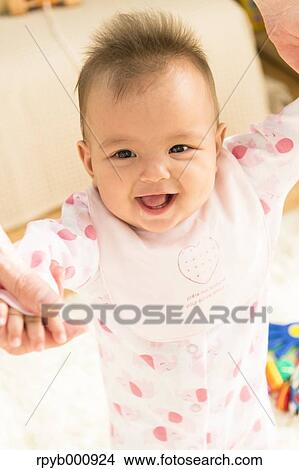 Picture - Newborn with his dad in the house. Fotosearch