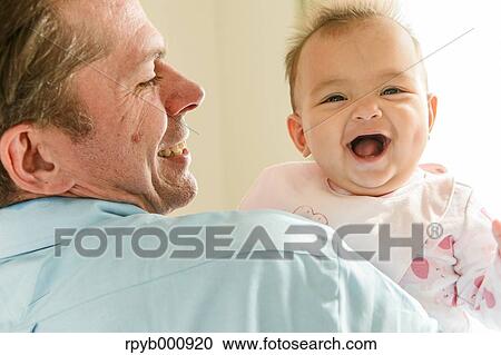 Newborn with his dad in the house View Large Photo Image Stock Image - Newborn with his dad in the house. Fotosearch