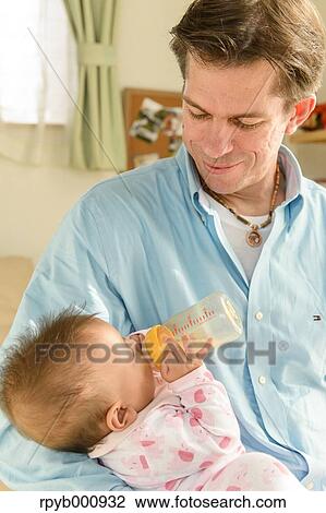Newborn with his dad in the house View Large Photo Image Stock Image - Newborn with his dad in the house. Fotosearch