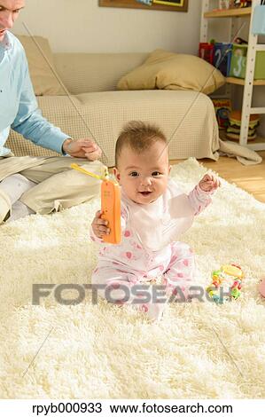 Newborn with his dad in the house View Large Photo Image Stock Image - Newborn with his dad in the house. Fotosearch