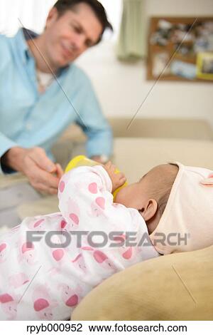 Newborn with his dad in the house View Large Photo Image Stock Image - Newborn with his dad in the house. Fotosearch