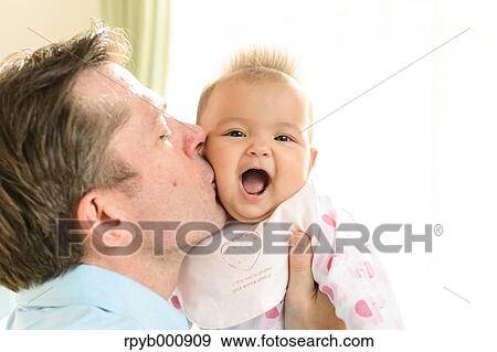 Newborn with his dad in the house View Large Photo Image Stock Photo - Newborn with his dad in the house. Fotosearch