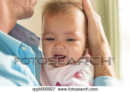 Newborn with his dad in the house View Large Photo Image Stock Photo - Newborn with his dad in the house. Fotosearch