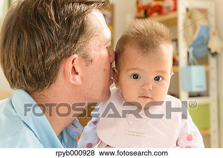 Newborn with his dad in the house View Large Photo Image Stock Photo - Newborn with his dad in the house. Fotosearch