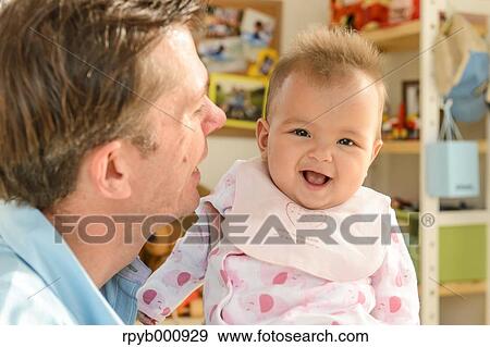 Newborn with his dad in the house View Large Photo Image Stock Photo - Newborn with his dad in the house. Fotosearch