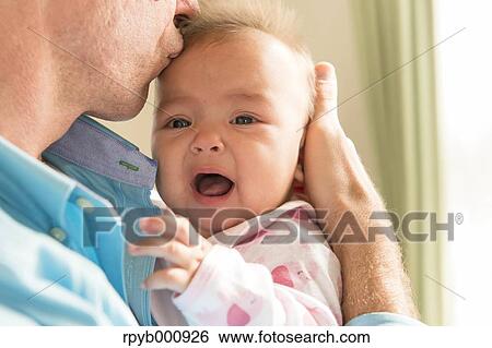 Newborn with his dad in the house View Large Photo Image Stock Photograph - Newborn with his dad in the house. Fotosearch