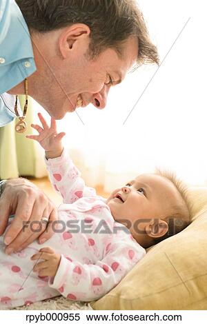 Newborn with his dad in the house View Large Photo Image Stock Photography - Newborn with his dad in the house. Fotosearch