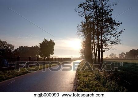Stock Image - Road in the countryside. Fotosearch