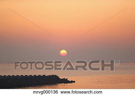 Stock Photograph - Sea at sunrise. Fotosearch
