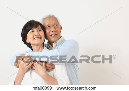 Senior adult Japanese couple against white wall View Large Photo Image Stock Image - Senior adult Japanese couple against white wall. Fotosearch